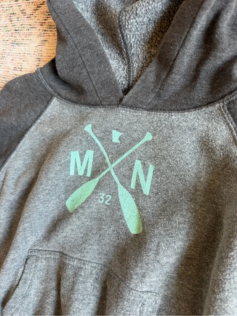 Minnesota Kids Charcoal Hooded Sweatshirt with Mint Oar Graphic